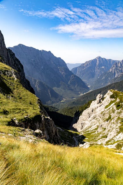 Explore the breathtaking alpine scenery of the Julian Alps with lush meadows and towering peaks.